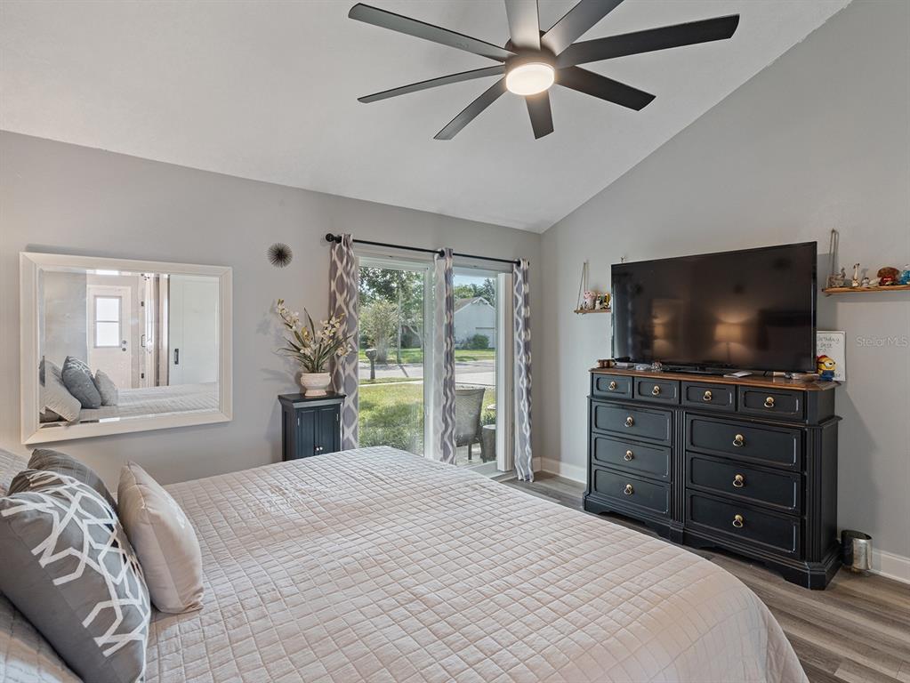 1360 Via Villanova Way Winter Springs, FL 32708 - Photo 17 of 32 a bedroom with a bed and a flat screen tv