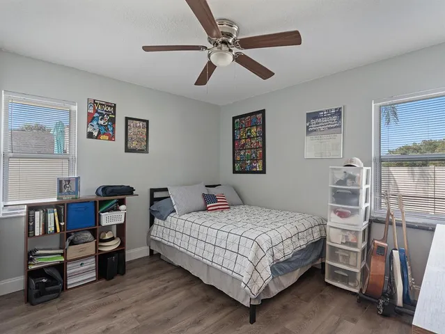 a bedroom with a bed and a book shelf