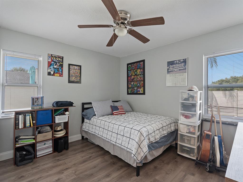 1360 Via Villanova Way Winter Springs, FL 32708 - Photo 22 of 32 a bedroom with a bed and a book shelf