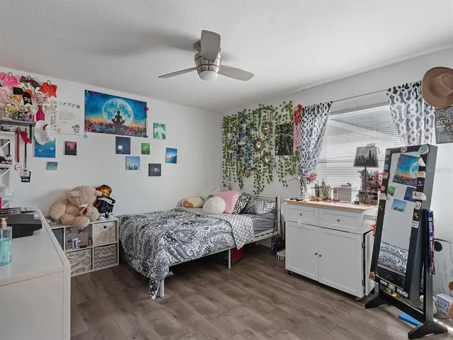 a room with a bed and furniture