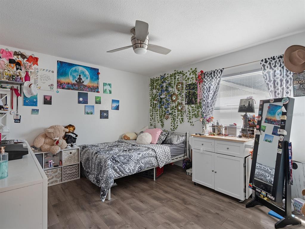 1360 Via Villanova Way Winter Springs, FL 32708 - Photo 24 of 32 a room with a bed and furniture