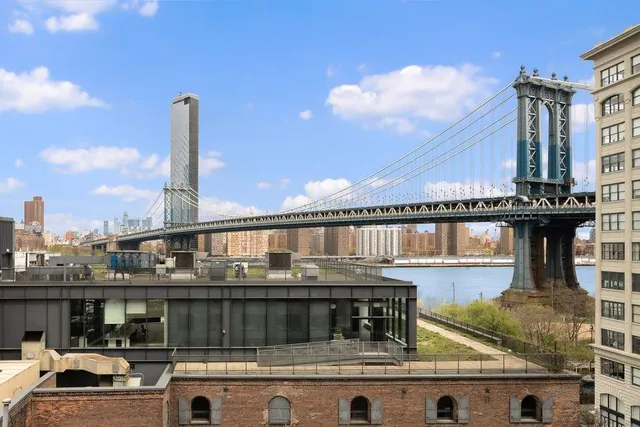a living room with furniture and large window