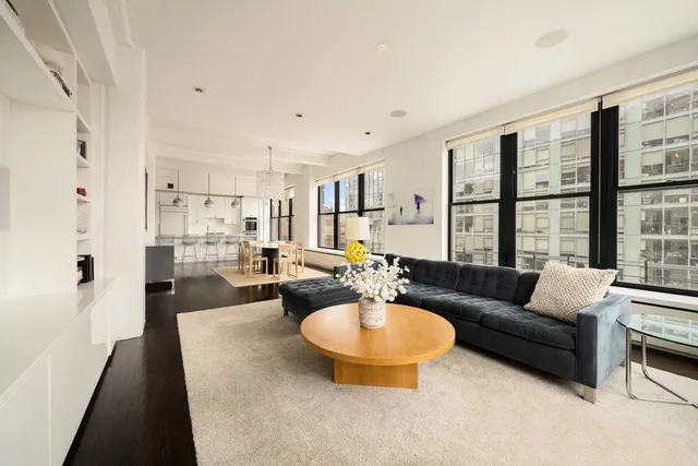 a view of a lake with a balcony and trees