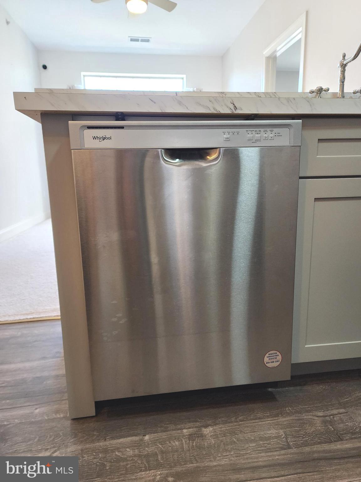 3000 Fountainview Circle, Unit 3411 Newark, DE 19713 - Photo 15 of 35 a view of a refrigerator with wooden floor