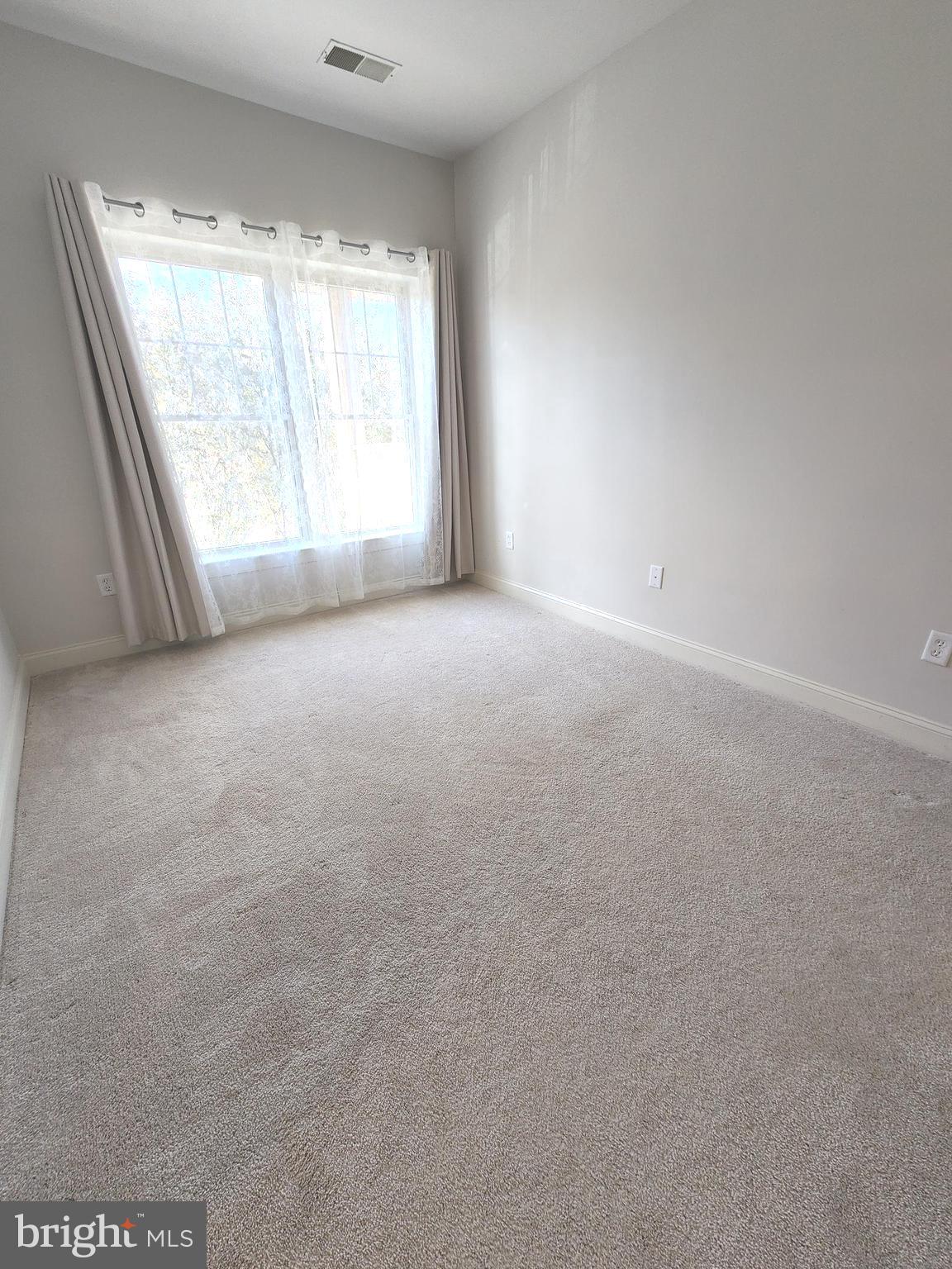 3000 Fountainview Circle, Unit 3411 Newark, DE 19713 - Photo 19 of 35 a view of an empty room with a window