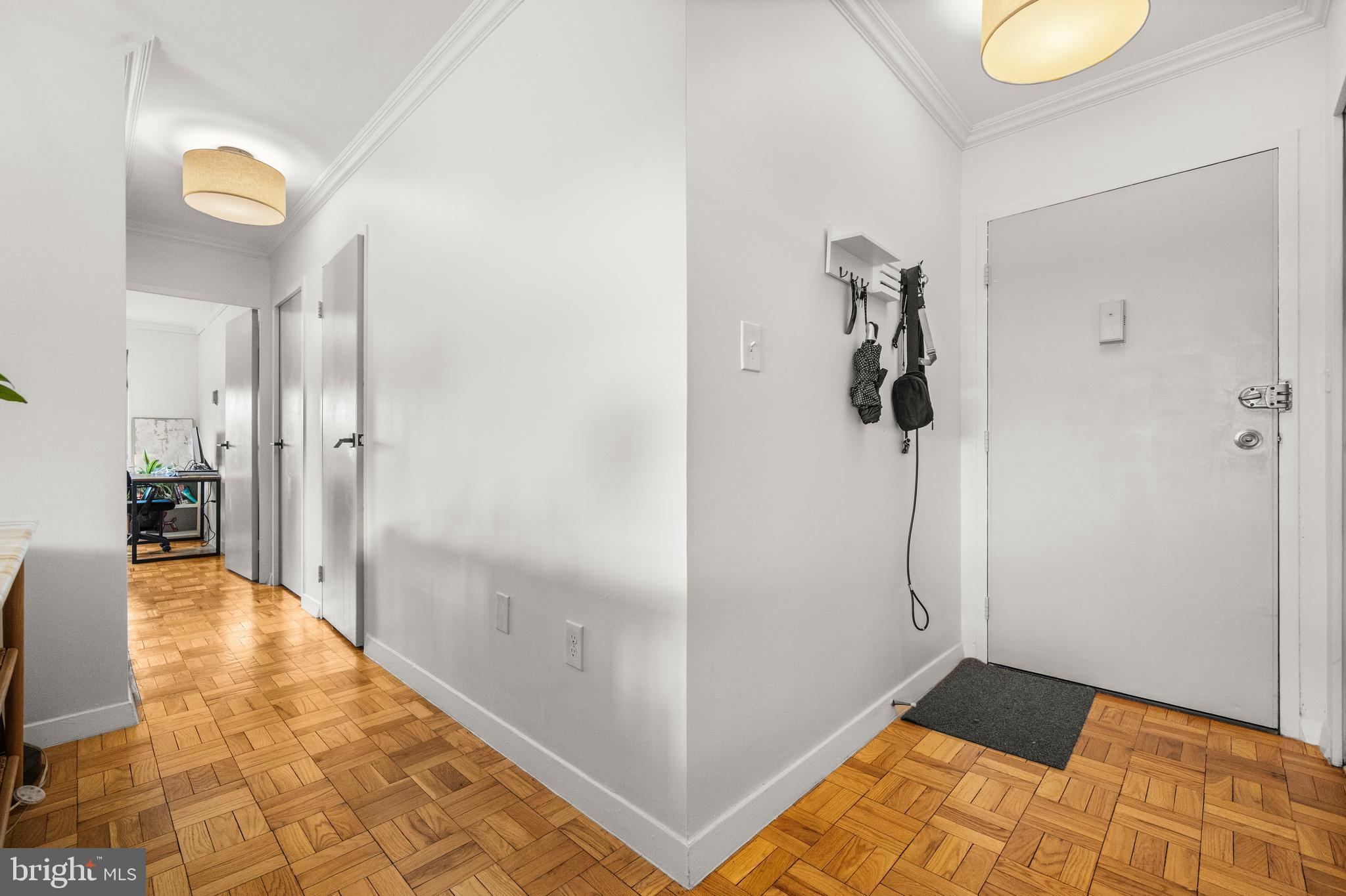 4600 Connecticut Avenue Northwest, Unit 810 Washington, DC 20008 - Photo 26 of 32 a view of a hallway with wooden floor and a bathroom