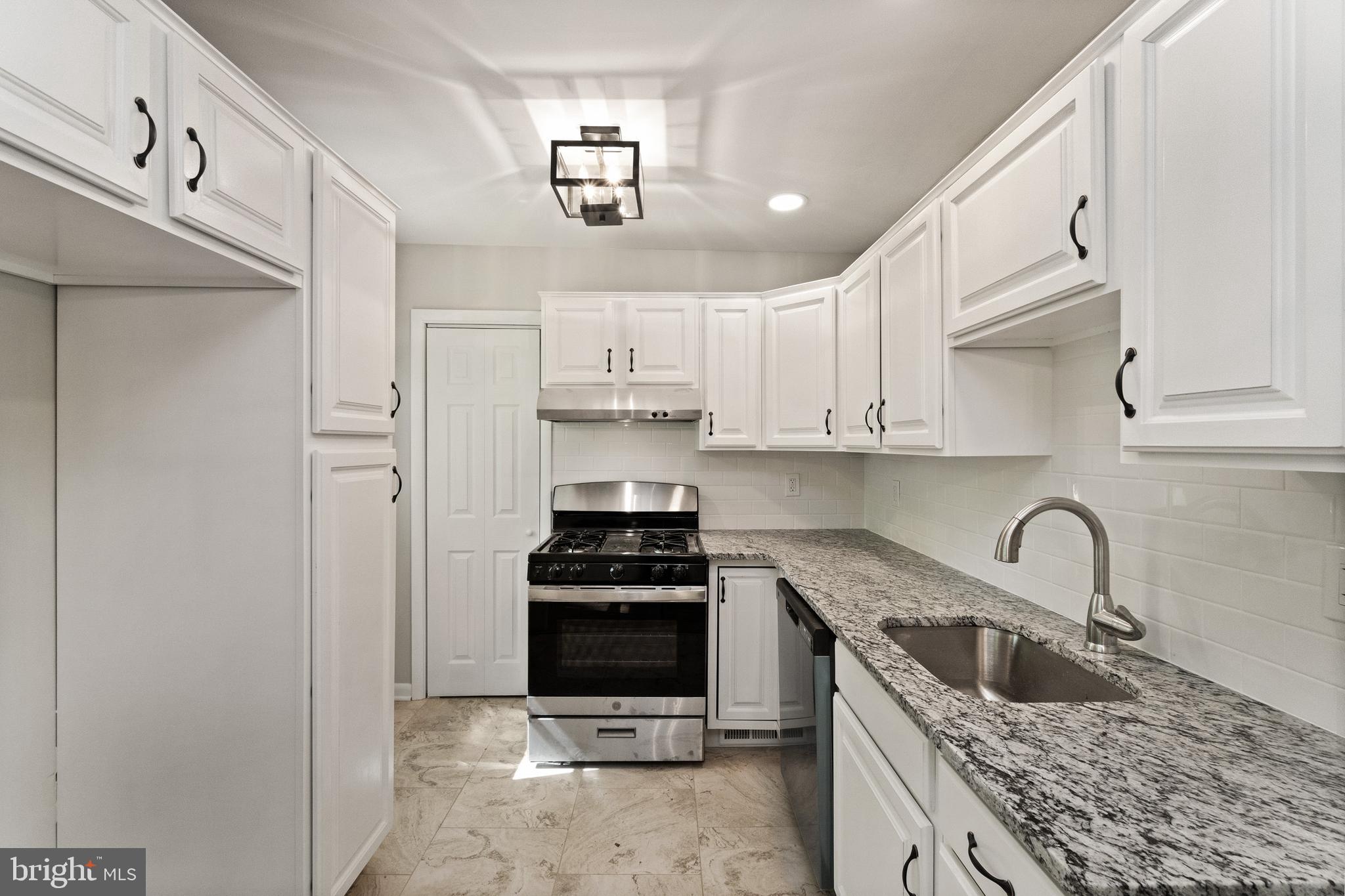 98 Wanner Road Reading, PA 19606 - Photo 15 of 30 a kitchen with stainless steel appliances granite countertop a sink stove and cabinets