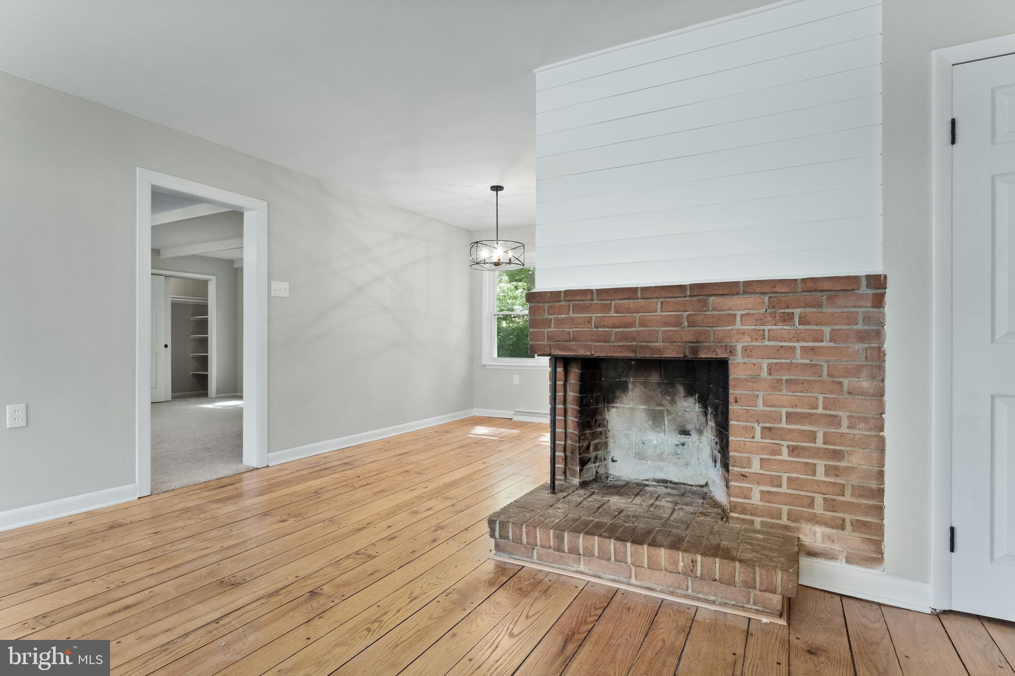 98 Wanner Road Reading, PA 19606 - Photo 19 of 30 a living room with a fireplace and wooden floor