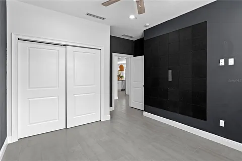 an empty room with closet and gallery