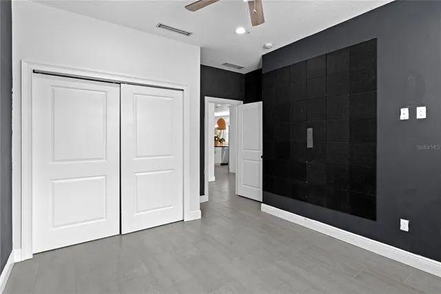 an empty room with closet and gallery