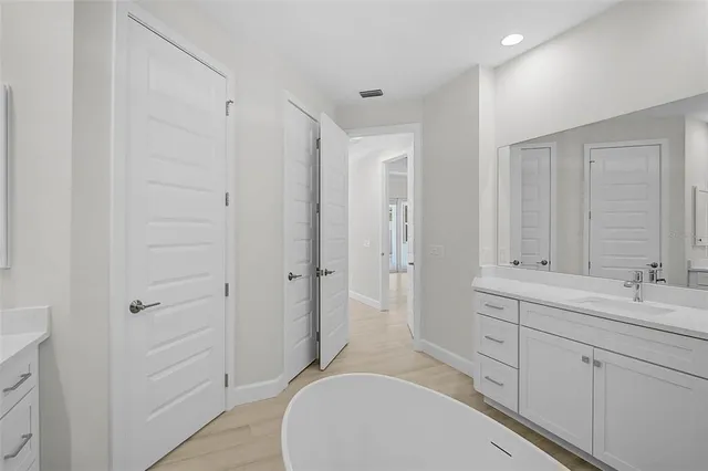 a view of a livingroom with a furniture and ceiling fan