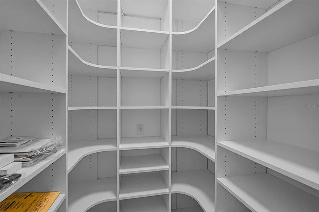 a view of a swimming pool with outdoor seating