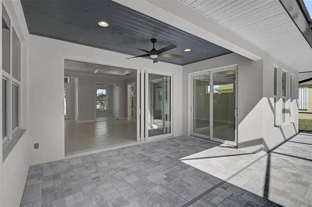 a aerial view of a house with swimming pool garden and patio