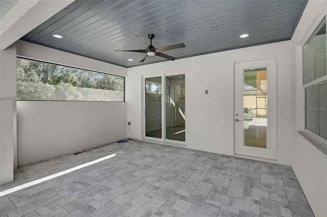 a view of a house with backyard porch and sitting area