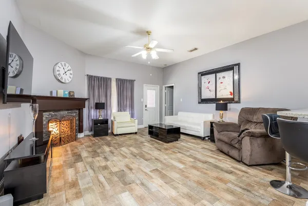 a living room with furniture and a fireplace