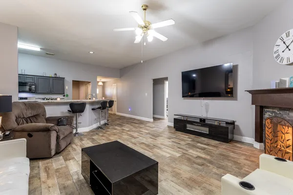 a living room with furniture and a flat screen tv
