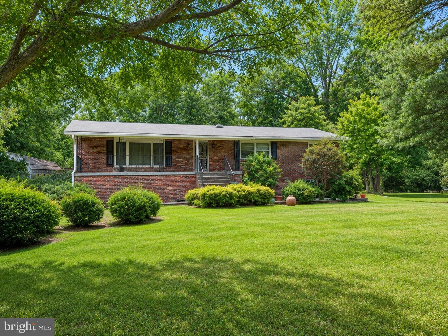 14103 Town Farm Road Upper Marlboro, MD 20774 - Photo 1 of 5 Charming brick home in lush greenery.