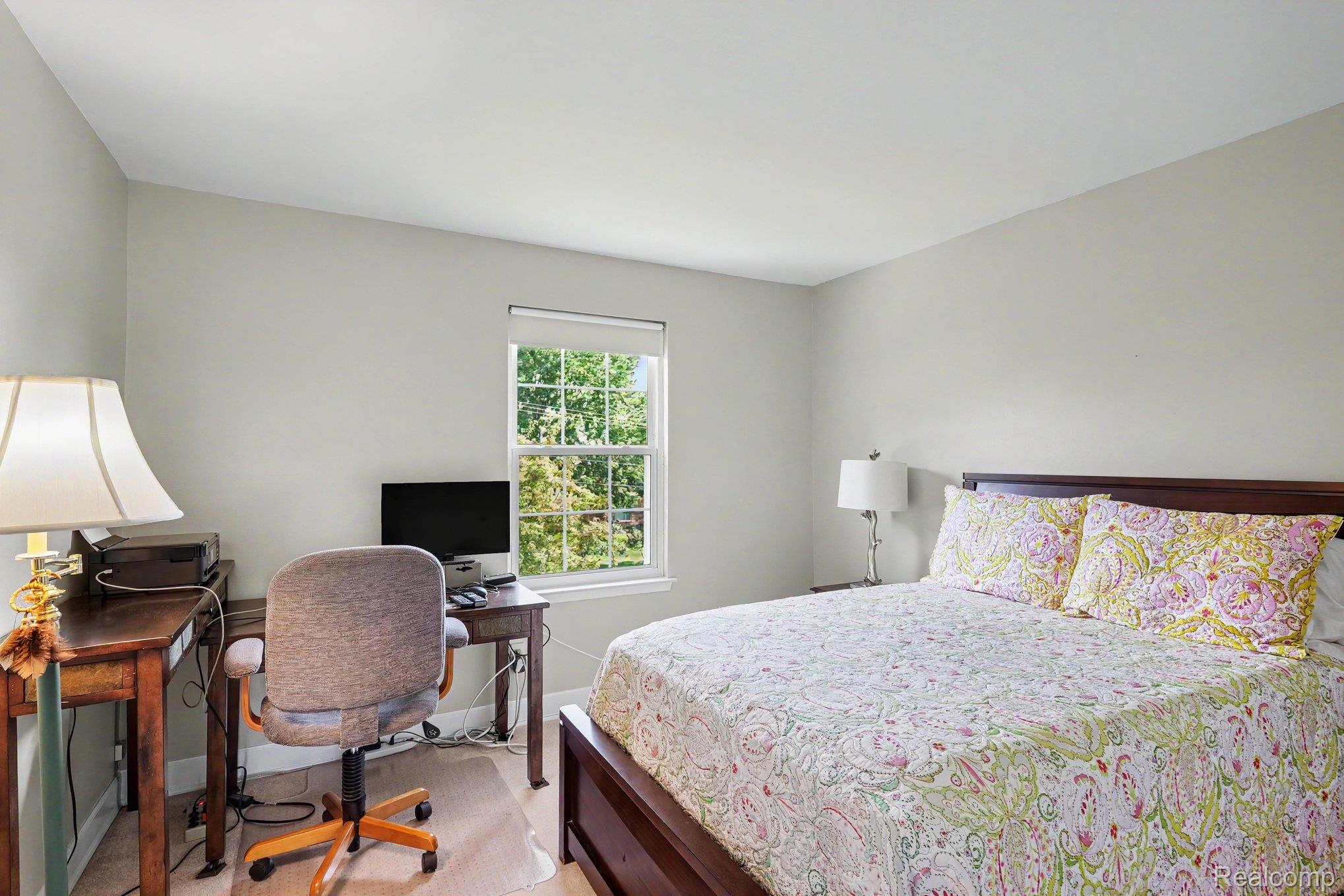 1692 Ridgecrest Rochester, MI 48306 - Photo 15 of 31 Light-toned walls, a single window with roller shade, and a wood-finish bed frame