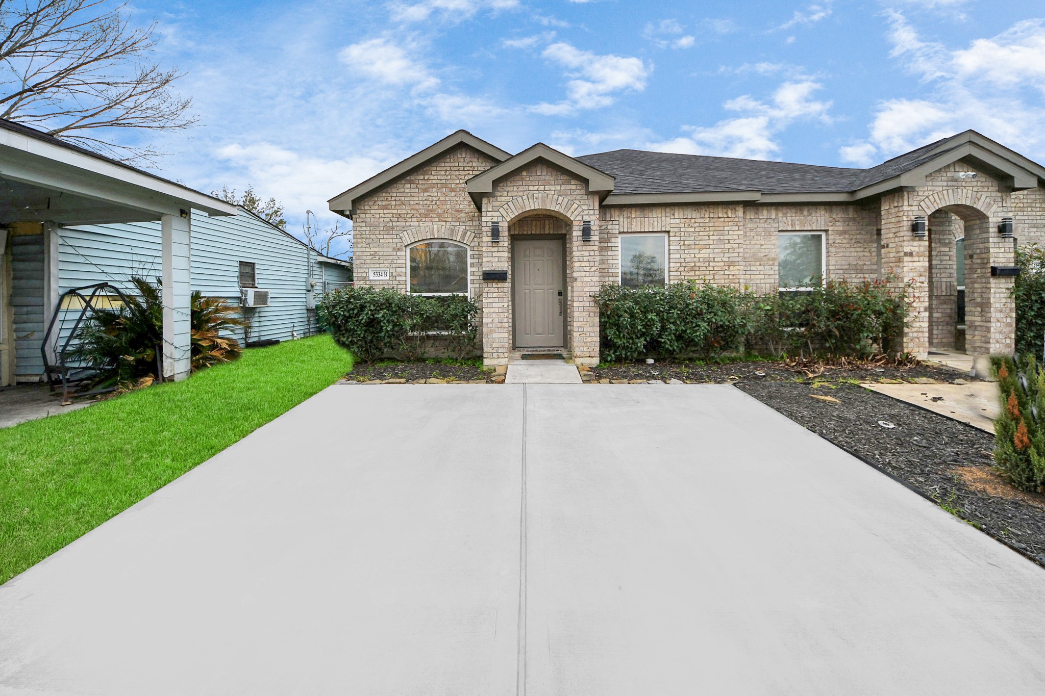 5334 Pershing Street Houston, TX 77033 - Photo 2 of 43 a front view of a house with a garden and plants