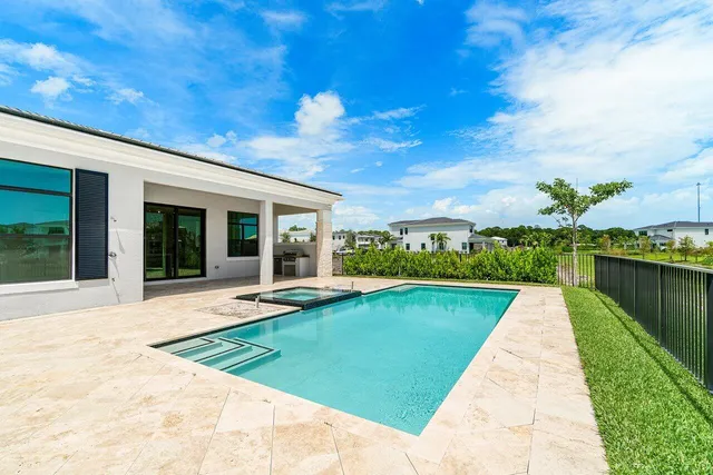 a view of swimming pool with a garden and trees