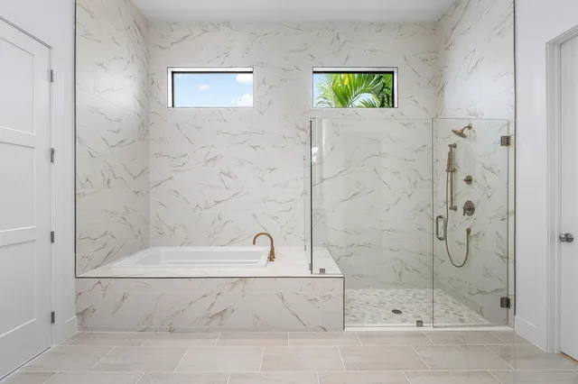 a bathroom with a double vanity sink and a mirror