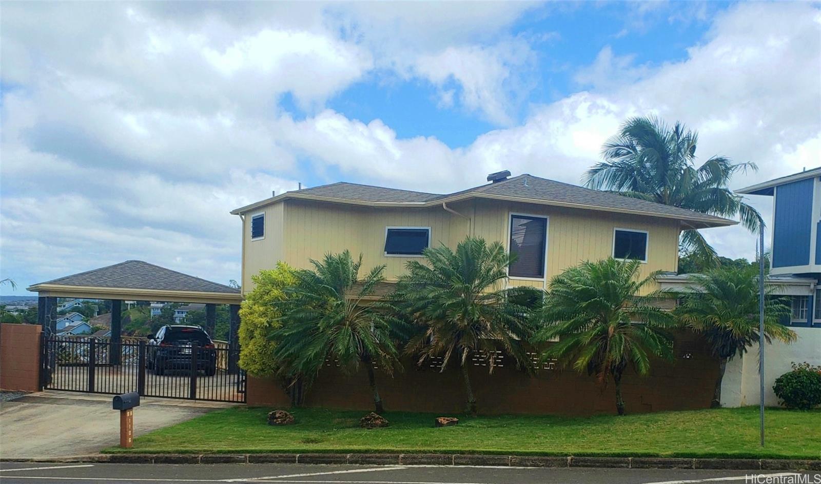99-1106 Halawa Heights Road, Unit A Aiea, HI 96701 - Photo 1 of 1 a view of a white house with a yard and plants