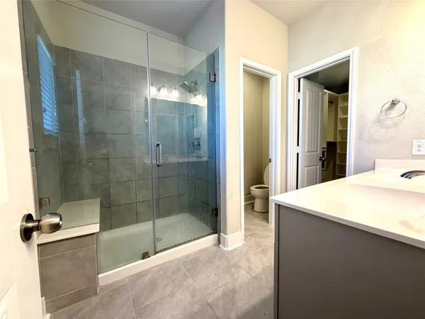 a bathroom with a bathtub and a shower