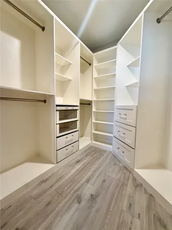 a view of an empty walk in closet