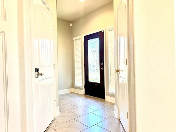 a view of a bathroom with a tub shower and a sink