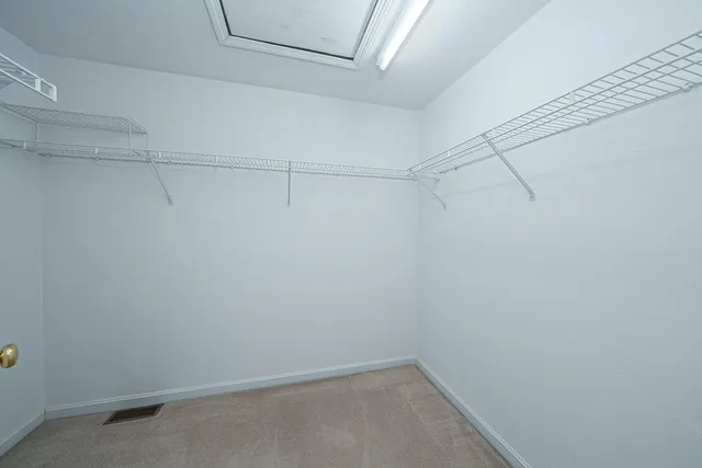 a view of a room with racks on the wall