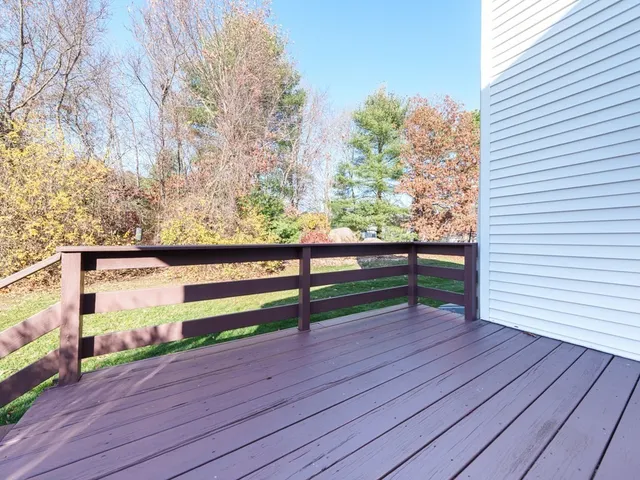a view of outdoor space with deck and yard