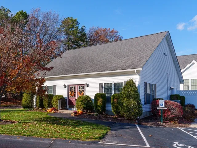 a view of a street with houses on the side