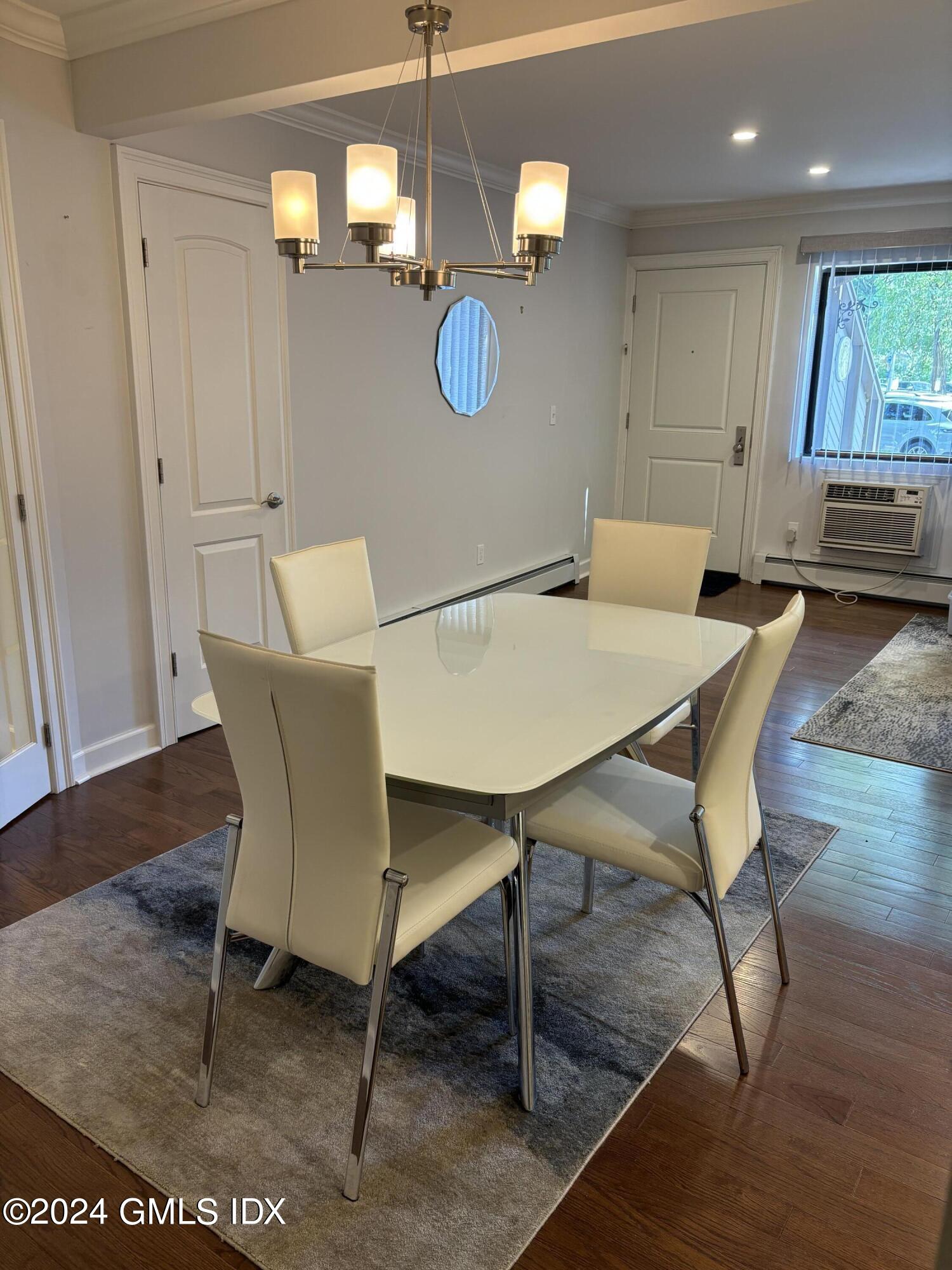 1465 East Putnam Avenue, Unit 306 Riverside, CT 06878 - Photo 8 of 13 a view of a dining room with furniture