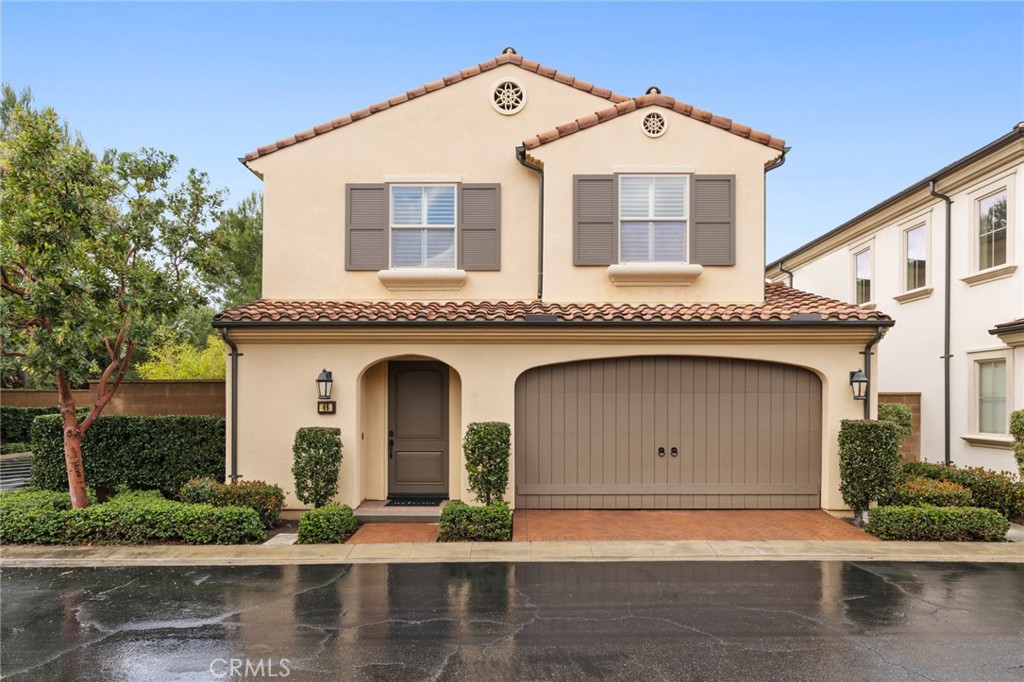 a front view of a house with garage