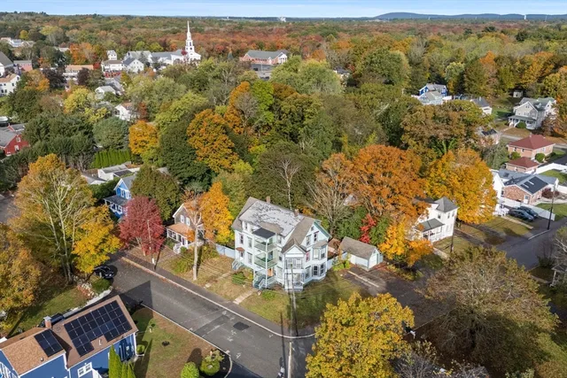 an aerial view of residential houses with outdoor space