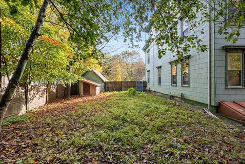 front view of a house with a trees