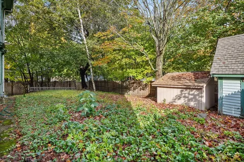 a backyard of a house with lots of green space