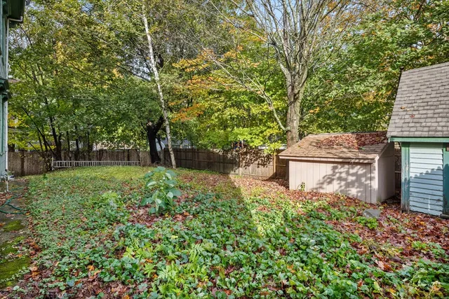 a backyard of a house with lots of green space