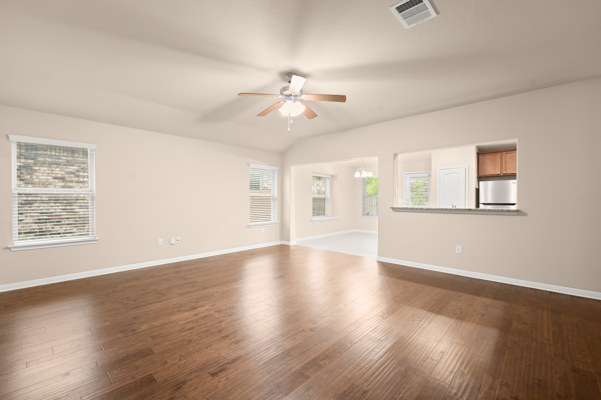 305 Longhorn Cavern Road Leander, TX 78641 - Photo 2 of 21 he heart of the home! This massive living area features gorgeous wood-look flooring and an open view right into the kitchen.