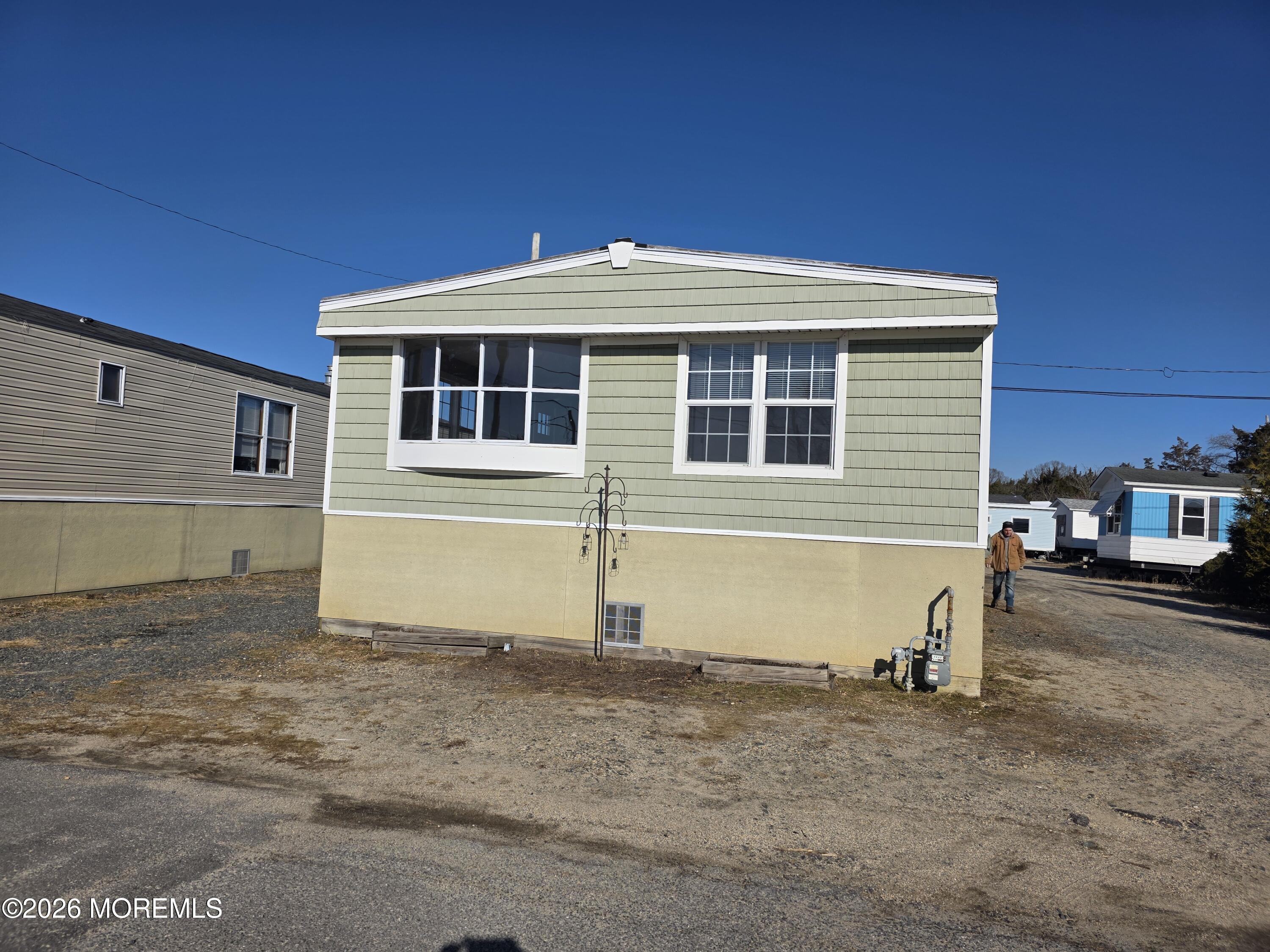 469 South Green Street, Unit 26 Tuckerton, NJ 08087 - Photo 1 of 17 a front view of a house with a yard