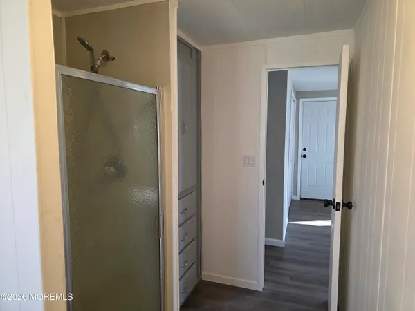 a bathroom with a toilet a sink a vanity and mirror