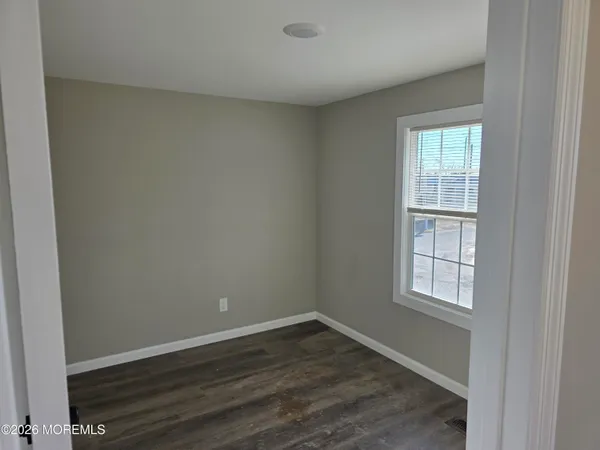 a view of a bathroom with a wooden door