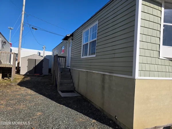 a view of a house with a street