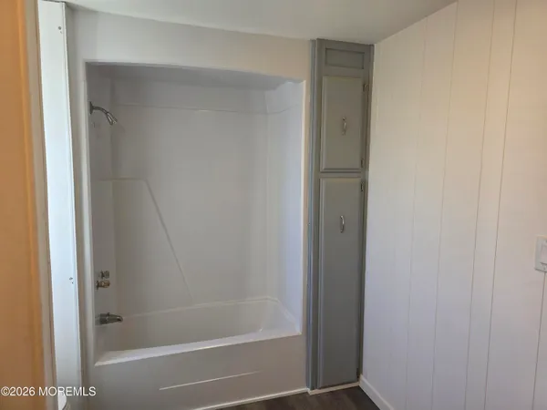 a bathroom with a mirror and a sink