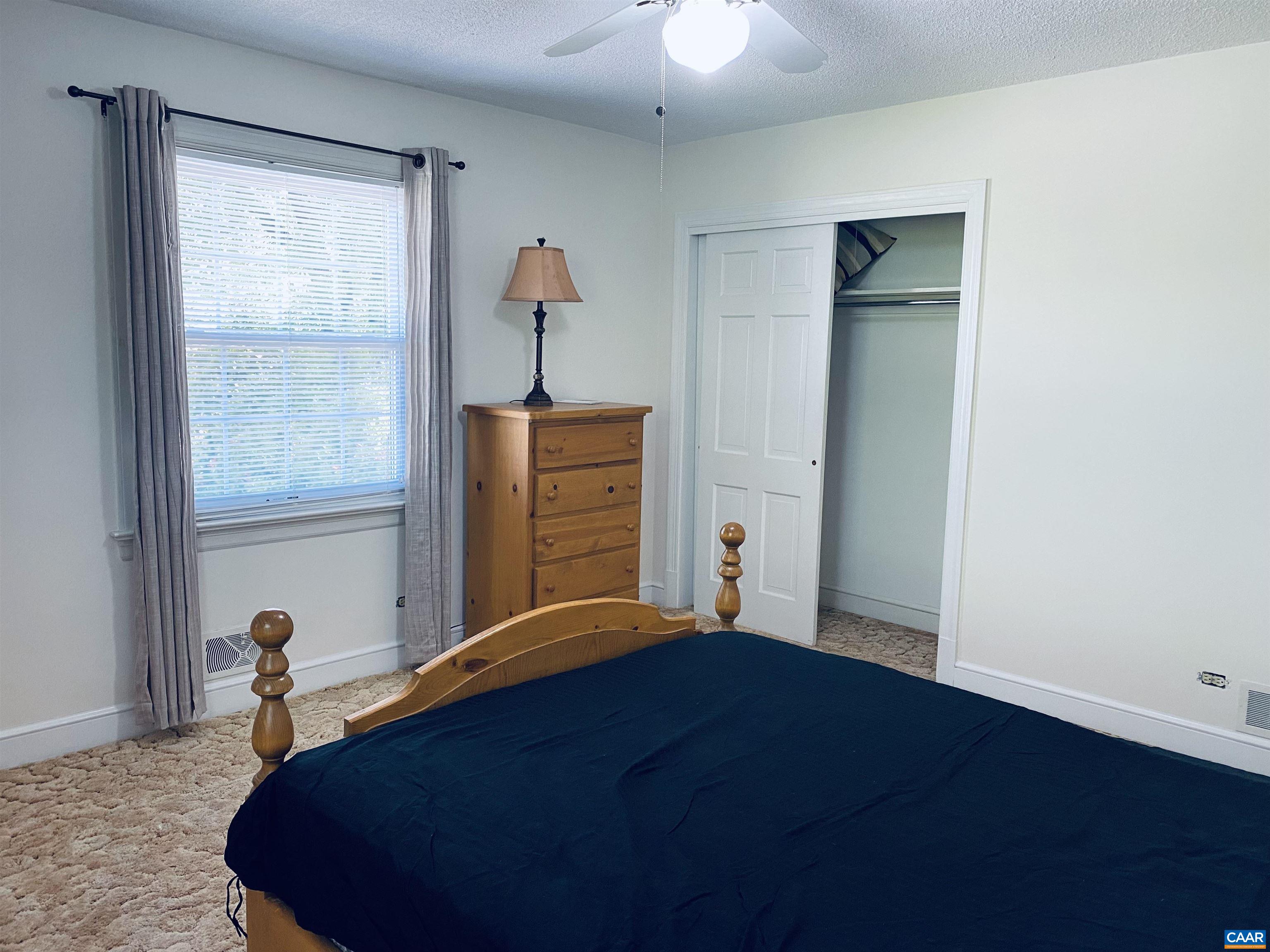 2401 Northfield Road Charlottesville, VA 22901 - Photo 18 of 23 a bedroom with a bed and a window