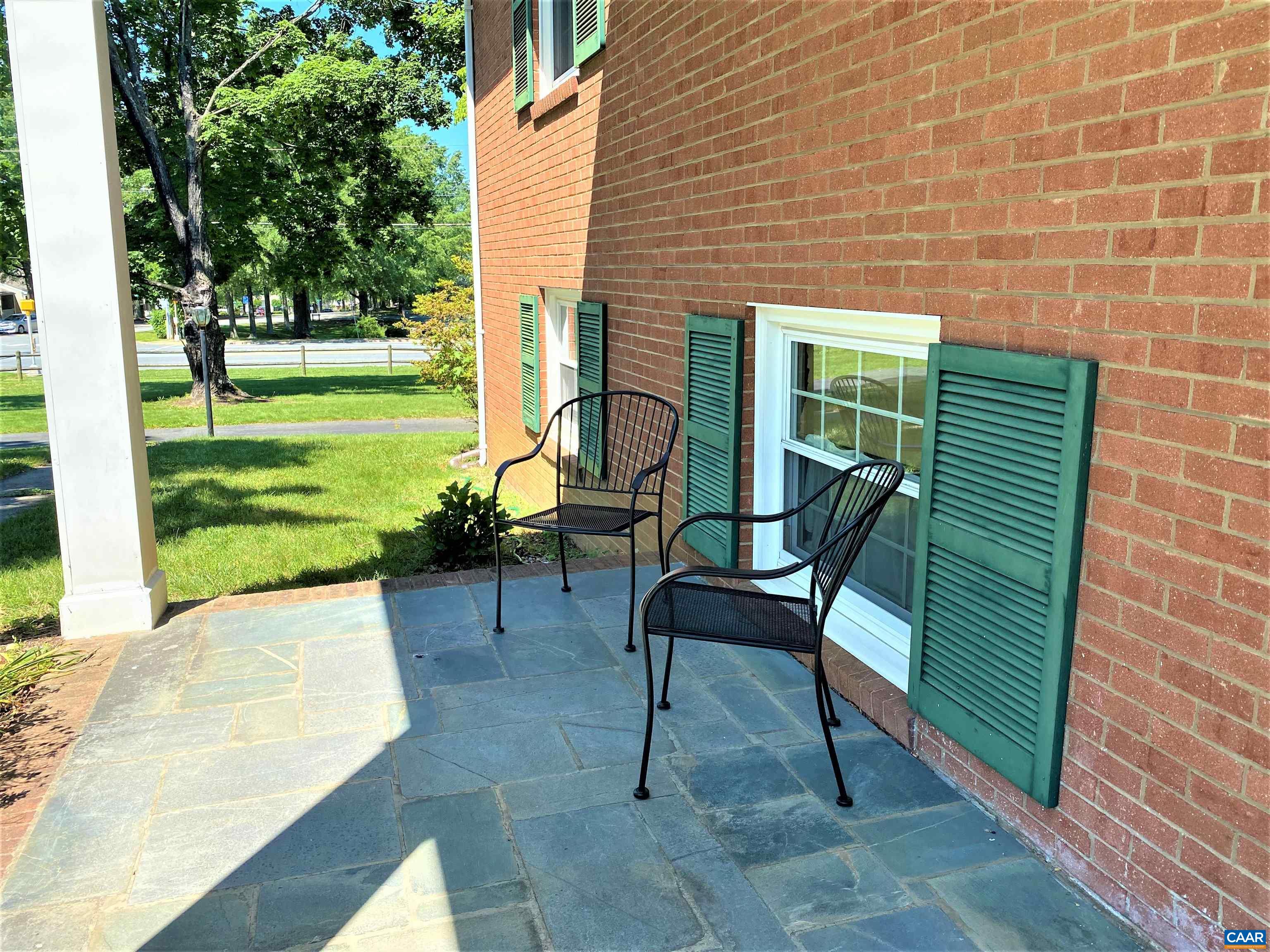 2401 Northfield Road Charlottesville, VA 22901 - Photo 3 of 23 a view of a chairs and table in backyard of the house