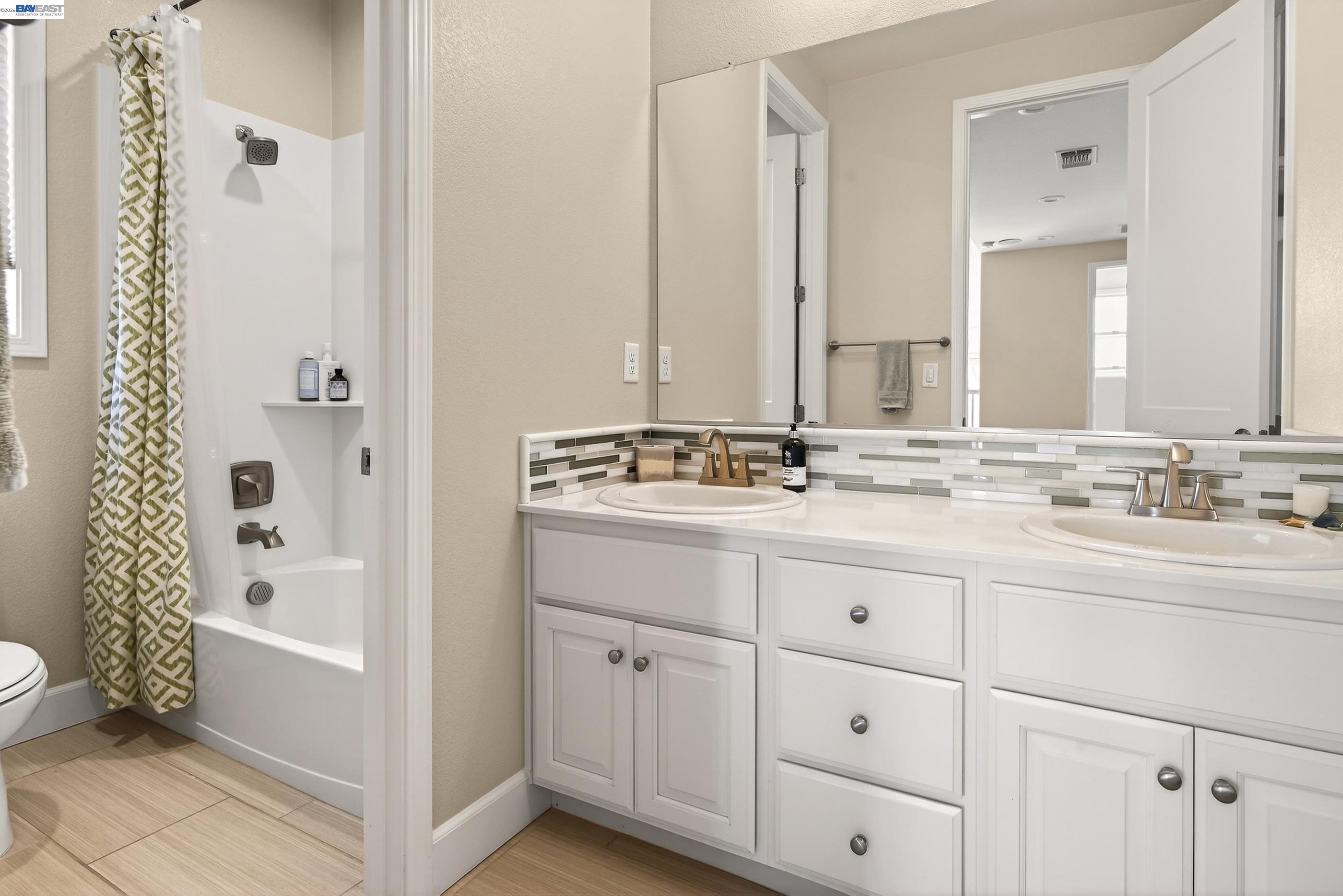 5531 Metropolitan Way Dublin, CA 94568 - Photo 21 of 56 a bathroom with a double vanity sink mirror and toilet