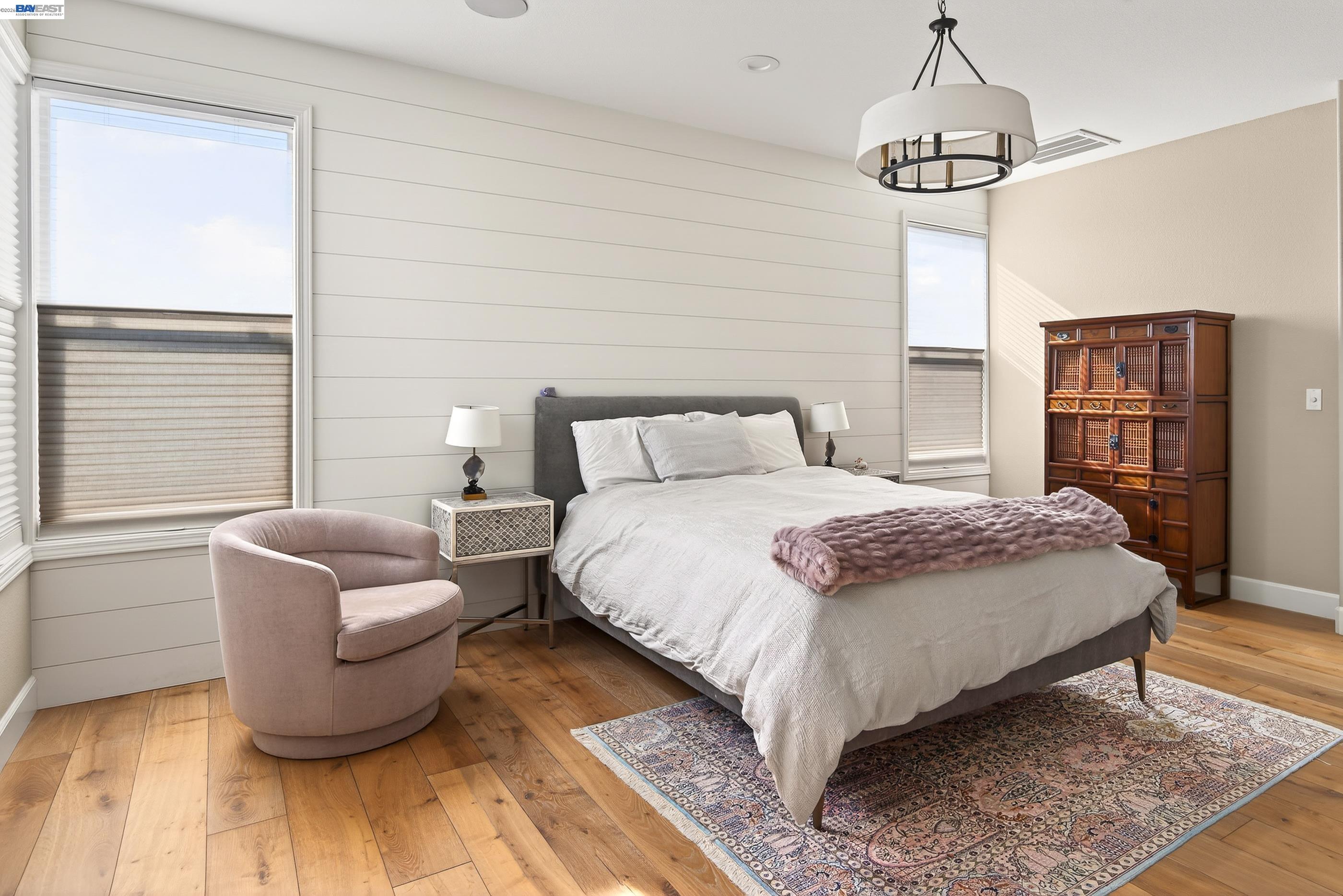 5531 Metropolitan Way Dublin, CA 94568 - Photo 23 of 56 a bedroom with a bed and wooden floor