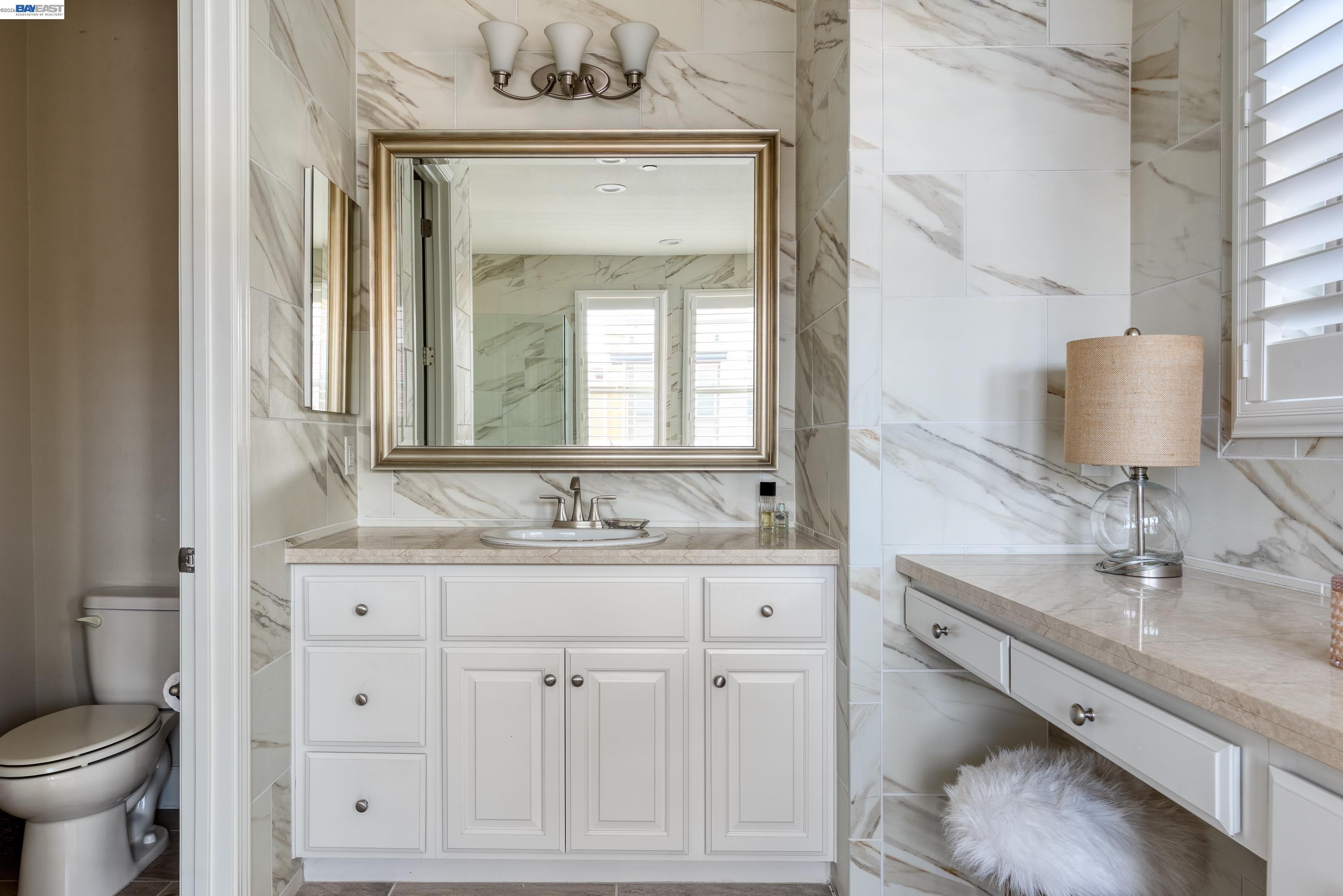 5531 Metropolitan Way Dublin, CA 94568 - Photo 28 of 56 a bathroom with a sink vanity and a mirror