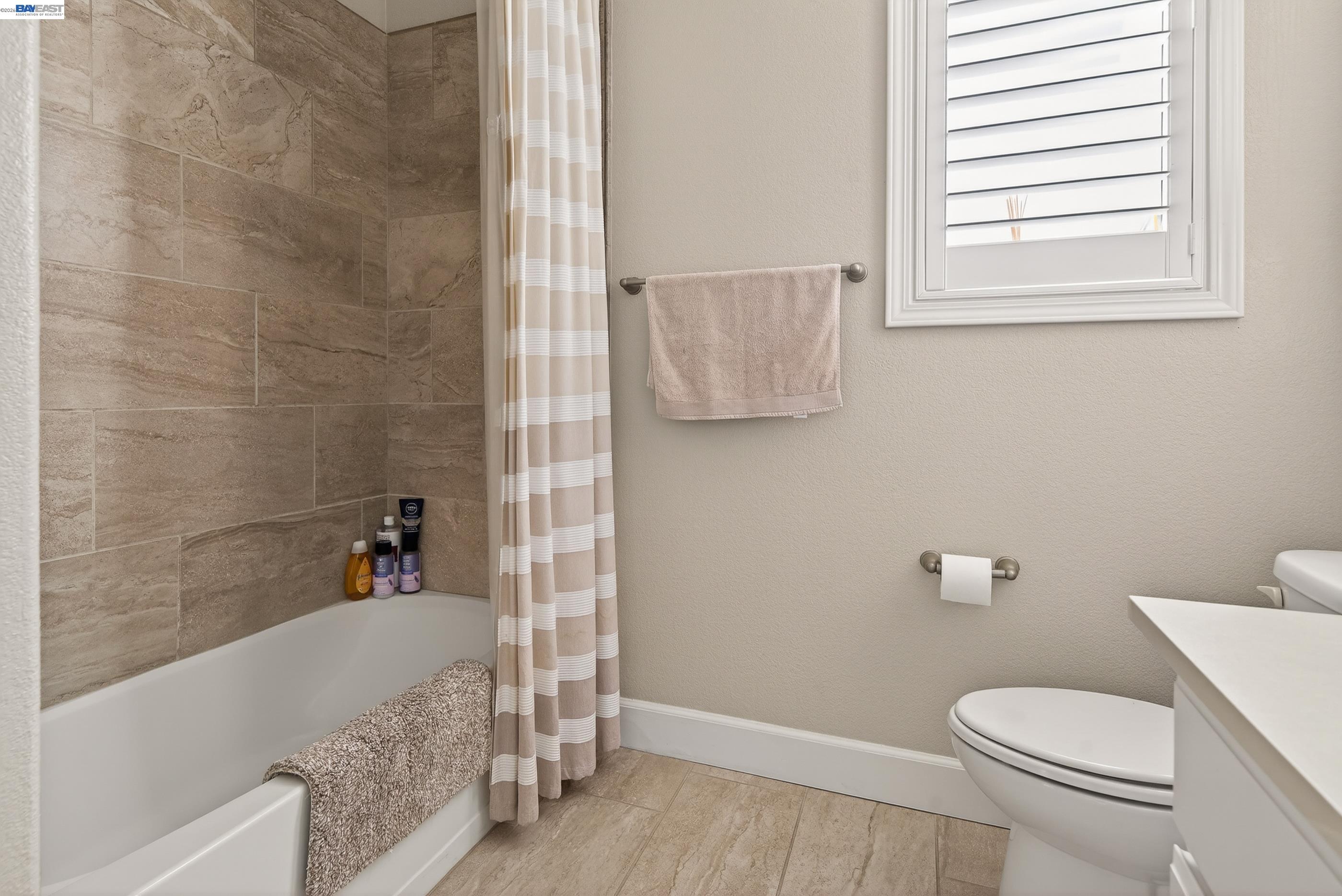 5531 Metropolitan Way Dublin, CA 94568 - Photo 41 of 56 a white toilet sitting next to a bath tub